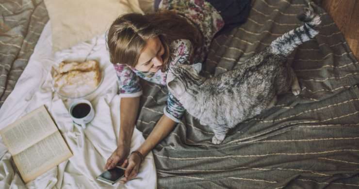A woman talking to her cat